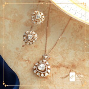 Classy Moissanite Swarovski Workwear Necklace - A stunning pendant set featuring a brilliant moissanite gemstone and shimmering Swarovski crystals, accompanied by a matching gold chain, designed for workwear elegance.